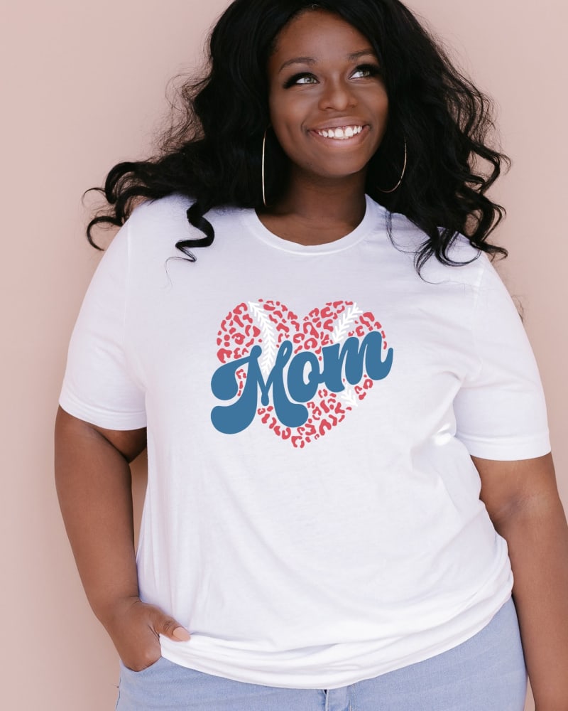 Front of a model wearing a size 2XL Baseball Mom Heart in White by Simply Sage Market. | dia_product_style_image_id:281666